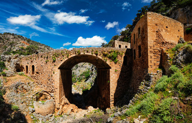 Fototapeta premium Riuns of abandoned Katholiko monastery church in Avlaki gorge, Akrotiri peninsula, Chania region on Crete island, Greece. Tracking shot