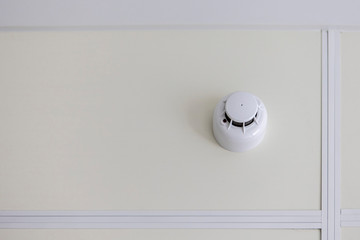 The smoke detector on the ceiling. Fire safety in the home