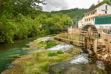 Fototapeta na wymiar River in the green forest. Thermal waters of Agroal - Tomar, Portugal