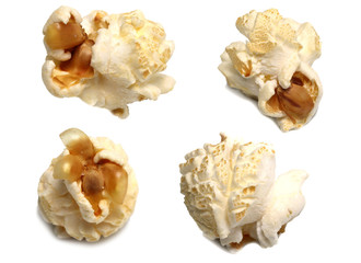 Popcorn is made from corn kernels on a white background.