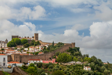 Fototapeta na wymiar Street views, castle walls and churches of Obidos, Portugal.
