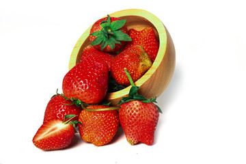Strawberries are arranged in different styles on a white background.