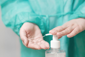 doctor treats hands with an antiseptic, antiviral treatment