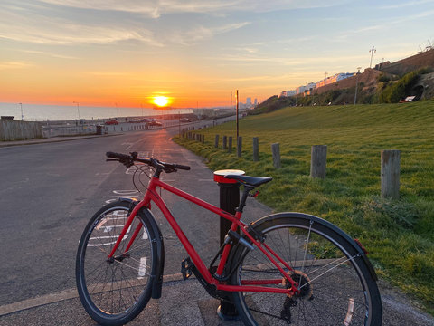 Road bike by the beach with a summer sunset, Brighton, UK