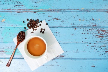Hot coffee in a white mug, black coffee on a blue wooden table
