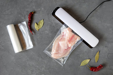 Vacuum packaging of fish. Extending the shelf life of products. Top view.