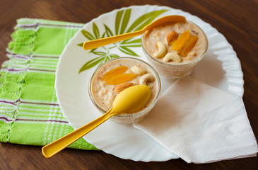 Cornflakes kheer or sweet pudding with dry fruits served in glass bowls