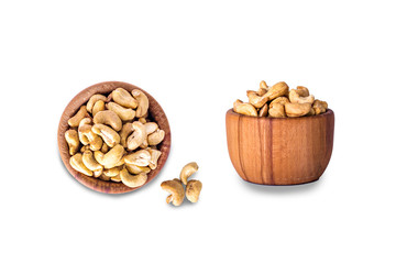 Cashew nuts in a wooden bowl on a white background.