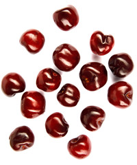 Fresh cherries scattered on white. Cherries on a white background. Cherry fruit. Creative fresh cherry pattern background with copy space. Top view. Sprinkled cherry on white background.Isolated fruit