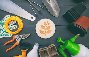 A lot of different garden equipment on the wooden table