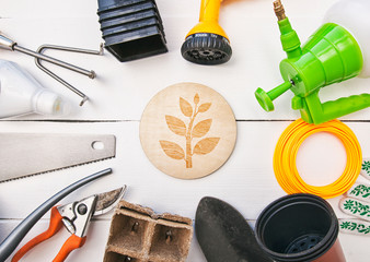 A lot of different garden equipment on the wooden table
