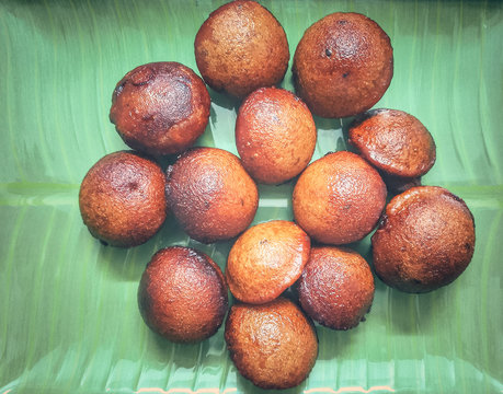 home made traditional Kerala snack unniyappan on green banana leaf ready to serve in a tea shop