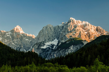 Beautiful sunset on the impressive wall of mountains in the slovenian alps