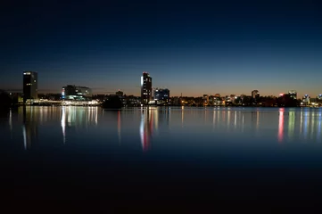 Fotobehang Night cityscape from Keilaniemi, Espoo business district showcasing the oldest highrise building in Finland. © Marko Hannula