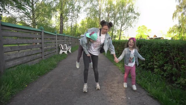 Mother with two naughty daughters in the Park, children dont listen to their mother, tired mother with twins