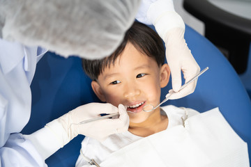 A boy having teeth examined at dentists: Healthy lifestyle, healthcare, and medicine concept.