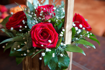 Wooden bouquet . A bouquet of roses in a wooden vase . Decorated flowers roses bunch in basket. Red roses flower bouquet in wooden box . Bouquet red roses .