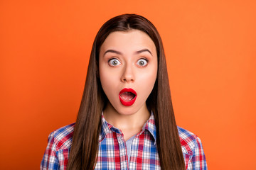 Closeup photo of attractive lady bright red pomade open mouth bad mood stupor not believe eyes epic fail wear casual plaid shirt isolated vibrant orange color background