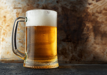 Full mug of cold light beer with copy space