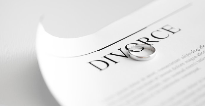 Divorce settlement agreement with rings. Close-up