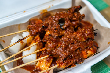 Grilled chicken skewers or satay with peanut sauce