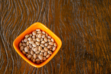 dishes with grains beans on wooden table