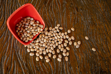 dishes with grains beans on wooden table