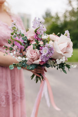 bride holding bouquet of flowers