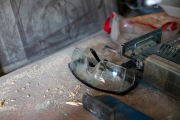 Workshop protective gear woodworking glasses dusty still life