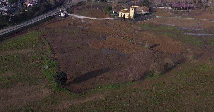 Revealing Aerial shot of new ACF Fiorentina soccer sport center area. Countryside field on Tuscany hills around Florence bought by president Commisso. Bagno a Ripoli, South Florence. Europe Italy