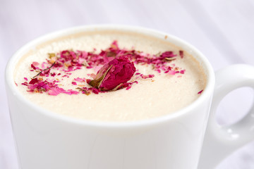 tasty cappuccono with rose petals