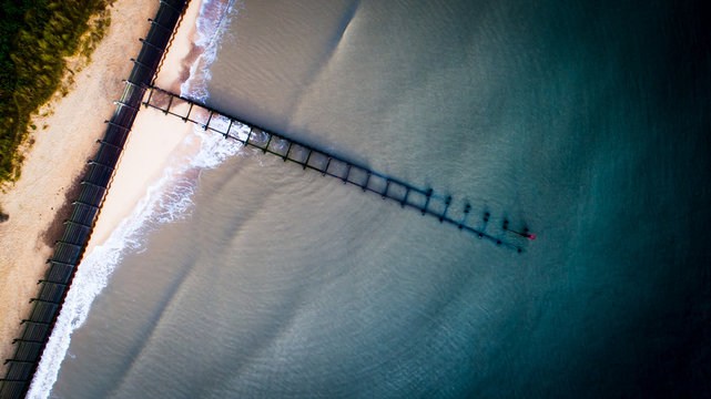 Shore and groin gain out to sea, ocean beach