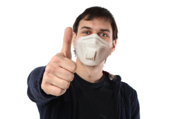 Thumb up isolated. Man in protective mask showing thumb up