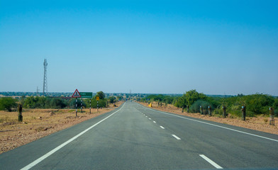 Highway, path, road in Desert of Rajasthan, India.
Road passing through a landscape, Jodhpur, Rajasthan, India