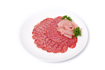 
Salami smoked sausage with slices of boiled pork cut into slices, on white
plate isolated on white background