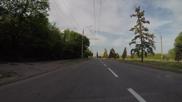 empty asphalt road against the background of trees