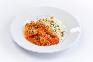 chicken with barley on teh white plate