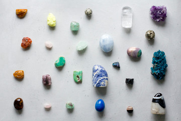 Beautiful bright multi-colored collection of natural stones and minerals from around world lies on...