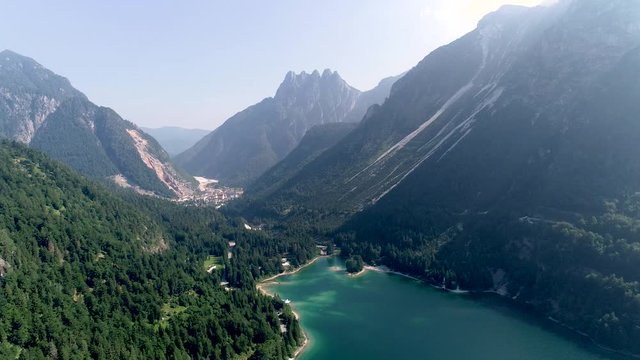 Aerial view from above Lago del predil of surrounding mountains. Rabeljsko jezero. Lake and Cinque Punte mountain in background