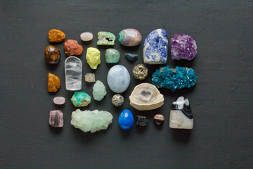 Beautiful bright multi-colored collection of natural stones and minerals from around world lies on...