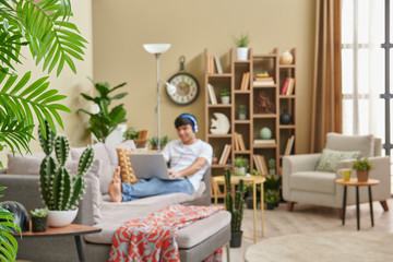 Man at home and corona virus warning interior decoration.