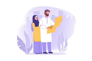 Travelling couple, hiking, tourism, nature, map concept. Arab couple man woman muslims hikers tourists travelers lost in forest and looking at map. Vacation trip with active lifestyle and recreation.