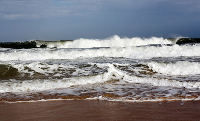 Storm on the beach. Ocean waves during a storm on a sandy beach. 