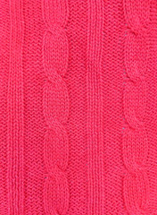 Pink knitted texture background. Pattern of wool knitting for wallpaper and an abstract background.