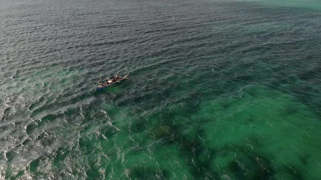 Flying over fisherman's boat next to Bantayan island, Cebu, Philippines