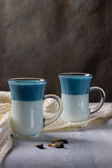 Latte Matcha Dalgona with milk. Fashionable drink from butterfly peas. Vertical orientation