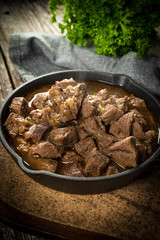 Beef stew in a cast iron skillet.