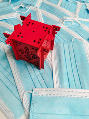 Red pavilion representing China on a background of blue disposable surgical masks