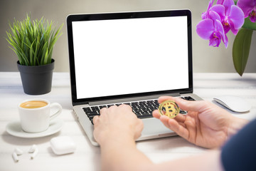Bitcoin shopping concept, Laptop computer white blank screen on work table front view. Copy space, home office workspace concept, laptop mockup.