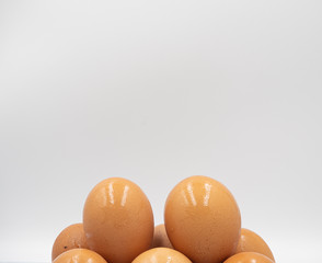 Focus shot on the top of stack of eggs after taking out from fridge